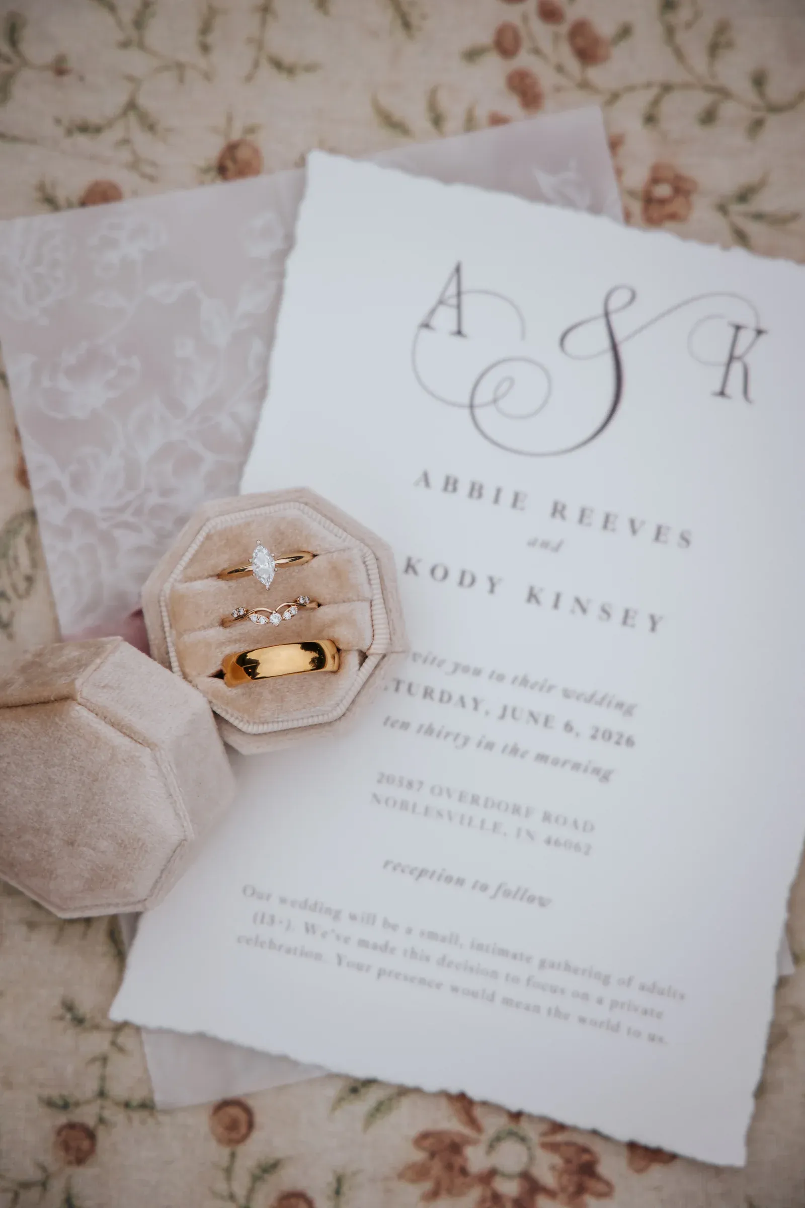Wedding invitation suite with rings and a soft ribbon detail
